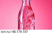 refreshing pink transparent A pink transparent plastic bottle ai generated. Стоковое AI-изображение, AI-художник Vectorwin / Фотобанк Лори