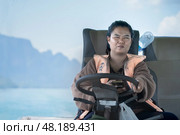 Thailand, Khao Sok 2025 14 02: Women professions. Portrait of a woman at her workplace - helmsman captain of a tourist boat at the helm of a Longtail boat on Cheo Lan Lake. Редакционное фото, фотограф Владимир Разгуляев / Фотобанк Лори