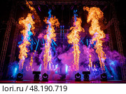 The final bow, the stage behind the performers erupting in a controlled inferno, Стоковое AI-изображение, AI-художник Anastasy Yarmolovich / Фотобанк Лори