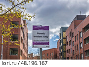 Urban parking signs indicating Permit Holders Only parking restrictions. London, UK, 24 March 2024. Редакционное фото, фотограф Zydrius Tartenis / Фотобанк Лори