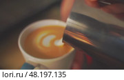4k, barista pouring milk into espresso coffee for making cappuccino, latte art, slow motion. Стоковое видео, видеограф Сергей Богомяко / Фотобанк Лори
