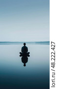Contemplative Individual Meditates by Tranquil Lake at Dusk. Стоковое AI-изображение, AI-художник Данила Большаков / Фотобанк Лори