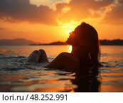 silhouette of woman relaxing in water at sunset, in the style of emotional sensitivity, serene faces, backlight, joyful and optimistic. Стоковое AI-изображение, AI-художник Sergey Grishin / Фотобанк Лори