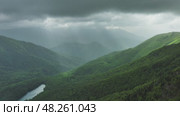 Clouds over summer green mountains. Стоковое видео, видеограф Михаил Коханчиков / Фотобанк Лори