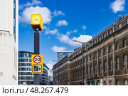Speed Camera Mounted on Pole Enforcing Traffic Regulations on City Street. Стоковое фото, фотограф Zydrius Tartenis / Фотобанк Лори