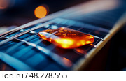 A close-up instrument: Guitar pick resting on strings of a guitar, glowing with bright light, focus on music instrument, song, practice, melody, chord. Стоковое AI-изображение, AI-художник Данила Большаков / Фотобанк Лори