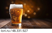 golden beer in a glass ai generated. Стоковое AI-изображение, AI-художник Vectorwin / Фотобанк Лори