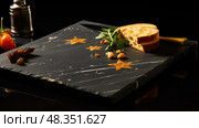 cuttingboard black background gold stars ai generated. Стоковое AI-изображение, AI-художник Vectorwin / Фотобанк Лори