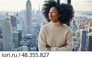 Contemplation above Metropolis: Woman meditates gazing at Cityscape from High-Rise, seeking solace and reflection in urban panorama. Стоковое AI-изображение, AI-художник Данила Большаков / Фотобанк Лори