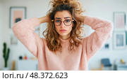Stressed Woman: Portrait of a Young Woman Overwhelmed, Grabbing Her Messy Hair, Expressing Anxiety and Confusion with a Worried Expression. Стоковое AI-изображение, AI-художник Данила Большаков / Фотобанк Лори