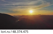 Flying over colorful foliage at sunset in mountains. Стоковое видео, видеограф Михаил Коханчиков / Фотобанк Лори