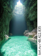 Bright rays of sunlight pierce through a rocky cavern, revealing stunning turquoise waters and rough stone formations, creating a tranquil escape. Стоковое AI-изображение, AI-художник Данила Большаков / Фотобанк Лори