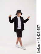 Stylish Child Models Trendy Urban Wear in a Spacious Studio Setup With Captivating Charm. Стоковое фото, фотограф Aleksandr Golubev / Фотобанк Лори