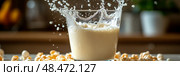 Splash of Freshness: A glass of milk spills amid a scattering of caramel popcorn, capturing a moment of playful indulgence. Стоковое AI-изображение, AI-художник Данила Большаков / Фотобанк Лори