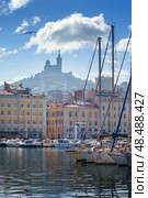 The Old Port Vieux Port of Marseille with Basilique Notre-Dame de la Garde blurred in the fog and the yauchts (2018 год). Стоковое фото, фотограф Сергей Богомяко / Фотобанк Лори