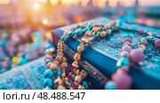 Ramadan concept: Ornate prayer bead arrangement on Quran with glowing sunset backdrop. Стоковое AI-изображение, AI-художник Данила Большаков / Фотобанк Лори