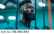 Concentrated Athlete: Portrait of a determined man during his rigorous training session at the fitness center. Стоковое AI-изображение, AI-художник Данила Большаков / Фотобанк Лори