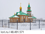 Церковь святого апостола Андрея Первозваного зимой во время снегопада. Село Вагай. Омутинский район. Тюменская область (2018 год). Стоковое фото, фотограф Александр Тараканов / Фотобанк Лори