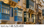 Typical Maltese covered balconies in Valetta, Malta (2018 год). Стоковое фото, фотограф Сергей Богомяко / Фотобанк Лори