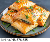 Spinach and feta stuffed spanakopita. Стоковое AI-изображение, AI-художник Татьяна  Бральнина / Фотобанк Лори