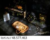 Still life with beads, perfume, lacquered cabinet and glasses. Стоковое фото, фотограф Сергей Фролов / Фотобанк Лори