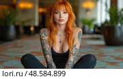 A woman with striking orange hair and elaborate tattoos sits cross-legged in a chic indoor environment, showcasing her unique style. Стоковое AI-изображение, AI-художник Данила Большаков / Фотобанк Лори