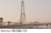 UAE, Dubai, 21 November 2024: The famous largest observation wheel The Eye of Dubai at sunset - Ain Dubai, island Bluewaters. Редакционное видео, видеограф Vladimir Drozdin / Фотобанк Лори