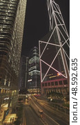 Modern skyscrapers reflect city skyline at night. Стоковое видео, видеограф Михаил Коханчиков / Фотобанк Лори