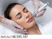 Facial treatment with advanced technology at a spa during daytime hours. Процедура ухода за лицом с использованием передовых технологий в спа-салоне в дневные часы. Стоковое AI-изображение, AI-художник Katsiaryna Repich / Фотобанк Лори