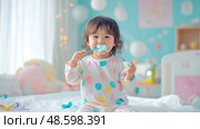 Joyful Toddler's First Toothbrushing Adventure: A Colorful Introduction to Oral Hygiene. Стоковое AI-изображение, AI-художник Данила Большаков / Фотобанк Лори