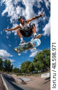 A man is doing a trick on a skateboard in the air. Стоковое AI-изображение, AI-художник Ярославский Максим / Фотобанк Лори