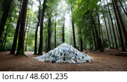 There is a lot of garbage in the forest. The concept of human pollution of forests and nature. A terrible dump in the woods. Стоковое AI-изображение, AI-художник ALLA YURTAYEVA / Фотобанк Лори