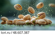 Pistachios exploding in mid-air with vibrant green elements in the background. Фисташки, взрывающиеся в воздухе, с яркими зелеными элементами на заднем плане. Стоковое AI-изображение, AI-художник Katsiaryna Repich / Фотобанк Лори