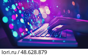 A person types on a neon-lit laptop, surrounded by digital data streams and cybernetic interfaces, representing modern technology and AI. Стоковое AI-видео, аниматор Данила Большаков / Фотобанк Лори