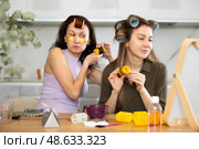 Two women curling their hair with curlers. Стоковое фото, фотограф Яков Филимонов / Фотобанк Лори