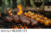 Tender steaks and golden potatoes sizzle over an open grill, complemented by a glass of red wine, creating a cozy outdoor dining experience. Стоковое AI-изображение, AI-художник Данила Большаков / Фотобанк Лори