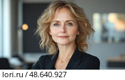 A poised woman stands confidently in a contemporary office, embodying professionalism and expertise in her field and ready for new challenges. Стоковое AI-изображение, AI-художник Данила Большаков / Фотобанк Лори
