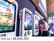 Vkusno i Tochka (Russian McDonald’s) fast food restaurant, self-service kiosk. Vkusno i Tochka is a chain of hamburger fast food restaurants. Редакционное фото, фотограф FotograFF / Фотобанк Лори