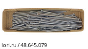 Коробка с гвоздями на белом фоне. Box with nails on white background. Стоковое фото, фотограф Татьяна Д / Фотобанк Лори