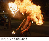 Image of fire show on the city street in night, Moscow Russia - 21 июля 2019. Редакционное фото, фотограф YuryKara / Фотобанк Лори