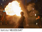 Image of fire show on the city street in night. Стоковое фото, фотограф YuryKara / Фотобанк Лори