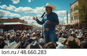 A crowd gathers in a sunny town square to hear a speaker discuss ranching issues, wearing cowboy hats and showing solidarity. Стоковое AI-изображение, AI-художник Данила Большаков / Фотобанк Лори