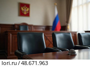 Зал заседаний суда, оформленный в строгом стиле, символизирующий правосудие и закон. Стоковое AI-изображение, AI-художник Сергей Никифоров-Гордеев / Фотобанк Лори