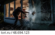 aftermath burglar breaking glass ai generated. Стоковое AI-изображение, AI-художник Vectorwin / Фотобанк Лори
