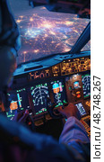 A pilots hands on the controls of a commercial airplane, cityscape seen through windshield. Pilot focused on instruments, guiding plane at night. Стоковое AI-изображение, AI-художник Данила Большаков / Фотобанк Лори