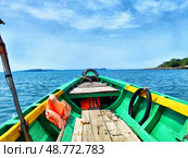 Green and yellow boat sailing on a sunny day towards islands in Phu Quoc, Vietnam. Стоковое фото, фотограф Кривошеина Елена Леонидовна / Фотобанк Лори
