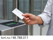 Office worker using electronic key card to open turnstile gate. Стоковое AI-изображение, AI-художник Юрий Поздников / Фотобанк Лори