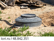 Septic tank Sewer system near the house. The device of the house. Стоковое фото, фотограф Александр Поташев / Фотобанк Лори