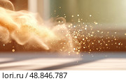 Golden dust particles floating in sunlight against blurred background. Стоковое AI-изображение, AI-художник Olga Didraga / Фотобанк Лори