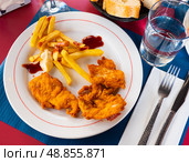 Crisp chicken nuggets with golden brown crust and french fries. Стоковое фото, фотограф Яков Филимонов / Фотобанк Лори